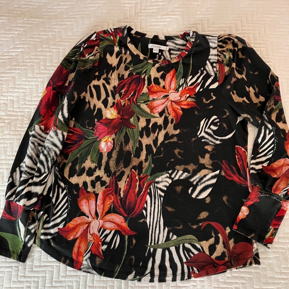 Chico's long sleeve size 2 top.  95% cotton, 5% spandex, washable. Black ground